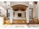Luxurious bathroom with a soaking tub and a cozy fireplace between bench seats on each side at 5810 Amber Ridge Dr, Castle Pines, CO 80108