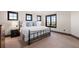 Stylish bedroom with dark-trimmed windows providing natural light and a tranquil ambiance at 5810 Amber Ridge Dr, Castle Pines, CO 80108