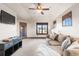 Cozy bonus room with a TV and comfortable seating at 5810 Amber Ridge Dr, Castle Pines, CO 80108
