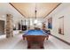 Basement game room with a pool table and bar area, great for recreation and relaxation at 5810 Amber Ridge Dr, Castle Pines, CO 80108