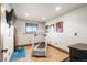 Bright home gym featuring a treadmill, TV, and yoga mat for convenient workouts at 5810 Amber Ridge Dr, Castle Pines, CO 80108