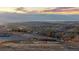 Scenic landscape view of a grassland and mountain range at 5810 Amber Ridge Dr, Castle Pines, CO 80108