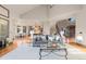 Open living space with hardwood floors and access to dining and kitchen areas at 5810 Amber Ridge Dr, Castle Pines, CO 80108