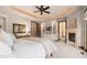 A stunning primary bedroom with a cozy fireplace and built-in storage at 5810 Amber Ridge Dr, Castle Pines, CO 80108