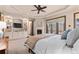 Spacious primary bedroom features a fireplace, built-in storage, and outside access at 5810 Amber Ridge Dr, Castle Pines, CO 80108