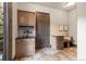 Mudroom with tiled floor, cabinets, and a bench, creating an organized entryway at 5810 Amber Ridge Dr, Castle Pines, CO 80108