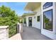 Spacious balcony with stone railing and wooded views, ideal for relaxing and entertaining outdoors at 8937 Little Raven Trl, Niwot, CO 80503