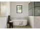 Luxurious bathroom featuring a freestanding tub, tiled shower, and stylish fixtures at 8937 Little Raven Trl, Niwot, CO 80503
