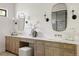Well-lit bathroom with a double vanity, marble countertops, and decorative mirrors at 8937 Little Raven Trl, Niwot, CO 80503