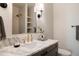 Modern bathroom with marble countertop, gold hardware, and stylish fixtures offers a spa-like experience at 8937 Little Raven Trl, Niwot, CO 80503
