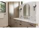 Stylish bathroom featuring a marble countertop, vanity, and modern lighting at 8937 Little Raven Trl, Niwot, CO 80503