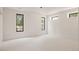 Bright bedroom with neutral carpet, large windows offering natural light and outdoor views for a calm retreat at 8937 Little Raven Trl, Niwot, CO 80503
