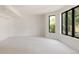 Spacious bedroom with large windows, plush carpet, and ample natural light creating a serene retreat at 8937 Little Raven Trl, Niwot, CO 80503