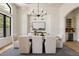 An elegant dining room with natural light, stylish lighting and a butler's pantry at 8937 Little Raven Trl, Niwot, CO 80503