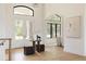 Bright foyer featuring soaring windows, hardwood floors and a modern, open layout at 8937 Little Raven Trl, Niwot, CO 80503