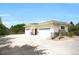 Detached garage with ample parking space and stone accents, set against a clear blue sky at 8937 Little Raven Trl, Niwot, CO 80503