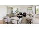Bright living room with neutral tones, modern furniture, and natural light at 8937 Little Raven Trl, Niwot, CO 80503