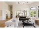Bright and spacious living room with hardwood floors and an open concept layout at 8937 Little Raven Trl, Niwot, CO 80503
