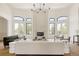 Expansive living room with soaring ceilings, fireplace, neutral decor and hardwood floors at 8937 Little Raven Trl, Niwot, CO 80503