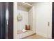 Mudroom with storage cubbies, a bench, and gold hardware accents at 8937 Little Raven Trl, Niwot, CO 80503