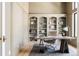 Inviting home office featuring built-in bookshelves, a cozy chair and a window at 8937 Little Raven Trl, Niwot, CO 80503