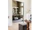 Charming home office with built-in shelving, neutral tones and large window at 8937 Little Raven Trl, Niwot, CO 80503