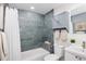 Bathroom with blue tile, bathtub and shower with white shower curtain at 555 W Peakview Ave, Littleton, CO 80120