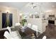 Dining room with a vaulted ceiling and view to the kitchen and living room at 555 W Peakview Ave, Littleton, CO 80120