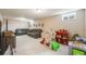 Spacious finished basement is being used as a playroom with light colored carpets at 8331 Mason Cir, Westminster, CO 80031