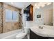 Nicely updated bathroom with dark wood vanity, soaking tub, and shower at 8331 Mason Cir, Westminster, CO 80031