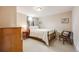 Bedroom with wood furnishings, plush carpeting, and a nice window at 8331 Mason Cir, Westminster, CO 80031