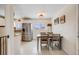 Bright dining area with a modern light fixture, views to the kitchen, and decorative wall art at 8331 Mason Cir, Westminster, CO 80031