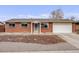 Charming brick home with a well-maintained front yard and attached garage at 8331 Mason Cir, Westminster, CO 80031