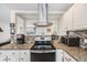 Modern kitchen showcasing stainless steel appliances and stylish tile backsplash at 8331 Mason Cir, Westminster, CO 80031