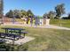 Playground area with colorful play structures, a climbing wall, and a picnic table at 8331 Mason Cir, Westminster, CO 80031