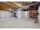 Unfinished basement featuring concrete floor and white plastic sheeting on the walls at 2668 Scoter Ln, Castle Rock, CO 80104
