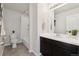 Bright bathroom featuring shower/tub combo, toilet, vanity with sink, and modern fixtures at 2668 Scoter Ln, Castle Rock, CO 80104