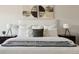 Beautifully staged bedroom with comfy bed, decorative pillows, stylish lamps and nightstands at 2668 Scoter Ln, Castle Rock, CO 80104
