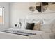 Close-up of a comfy bedroom with a plush bed, bedside table, and a modern lamp at 2668 Scoter Ln, Castle Rock, CO 80104