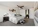 This beautifully decorated bedroom features a ceiling fan and ensuite bathroom at 2668 Scoter Ln, Castle Rock, CO 80104