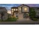 Charming two-story home boasts meticulous landscaping, inviting curb appeal and an attached two-car garage at 2668 Scoter Ln, Castle Rock, CO 80104