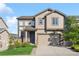 Charming two-story home boasts meticulous landscaping, inviting curb appeal and an attached two-car garage at 2668 Scoter Ln, Castle Rock, CO 80104