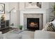 Cozy fireplace with white mantel and attractive tile surround at 2668 Scoter Ln, Castle Rock, CO 80104