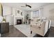 Bright living room features a cozy fireplace, modern decor, and ample seating for comfortable gatherings at 2668 Scoter Ln, Castle Rock, CO 80104