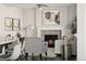 Open concept living space with fireplace, seating area and kitchen view at 2668 Scoter Ln, Castle Rock, CO 80104