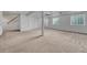 Unfinished basement with carpet flooring, white walls, and natural light from two large windows at 7114 Mountain Brush Cir, Highlands Ranch, CO 80130