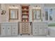 Bathroom featuring dual vanity, shelving and mirror in a neutral style at 7114 Mountain Brush Cir, Highlands Ranch, CO 80130