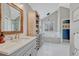 Luxurious bathroom with double vanity, soaking tub, and glass enclosed shower at 7114 Mountain Brush Cir, Highlands Ranch, CO 80130