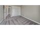 Carpeted bedroom featuring a closet, a neutral color scheme, and an adjoining room at 7114 Mountain Brush Cir, Highlands Ranch, CO 80130