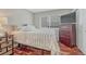 Cozy bedroom featuring plush bedding, hardwood floors, a window, and closet at 7114 Mountain Brush Cir, Highlands Ranch, CO 80130